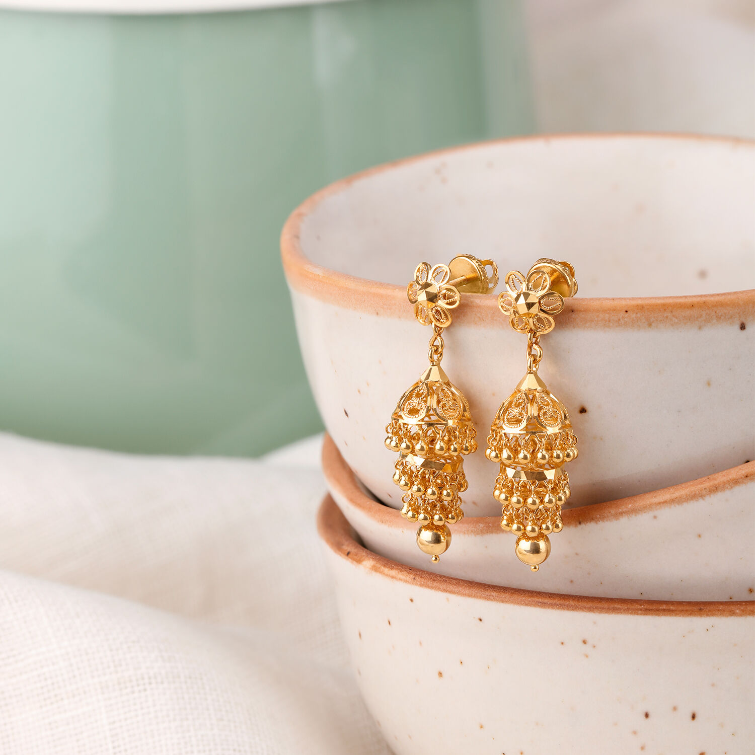 Bell Motif Gold Jhumka Earrings