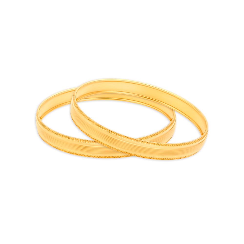 

Austere Yellow Gold Furrowed Bangles