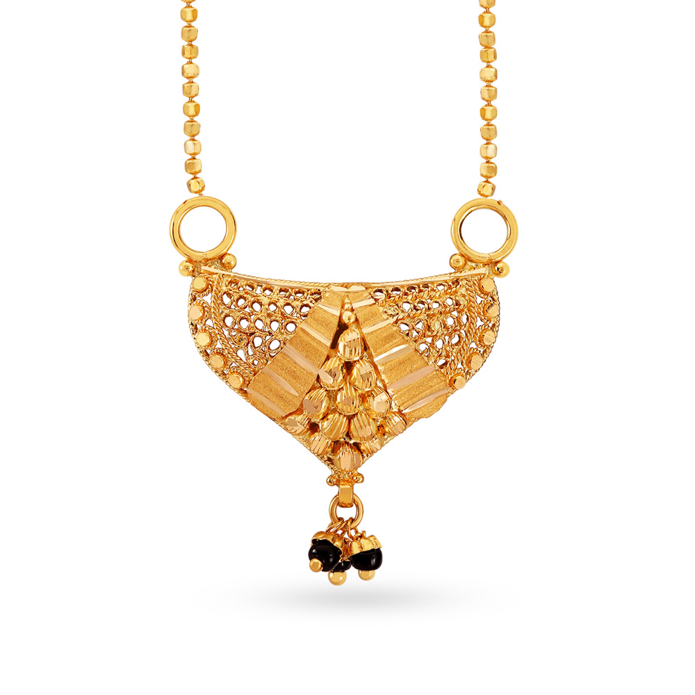 Gold mangalsutra designs on sale latest tanishq