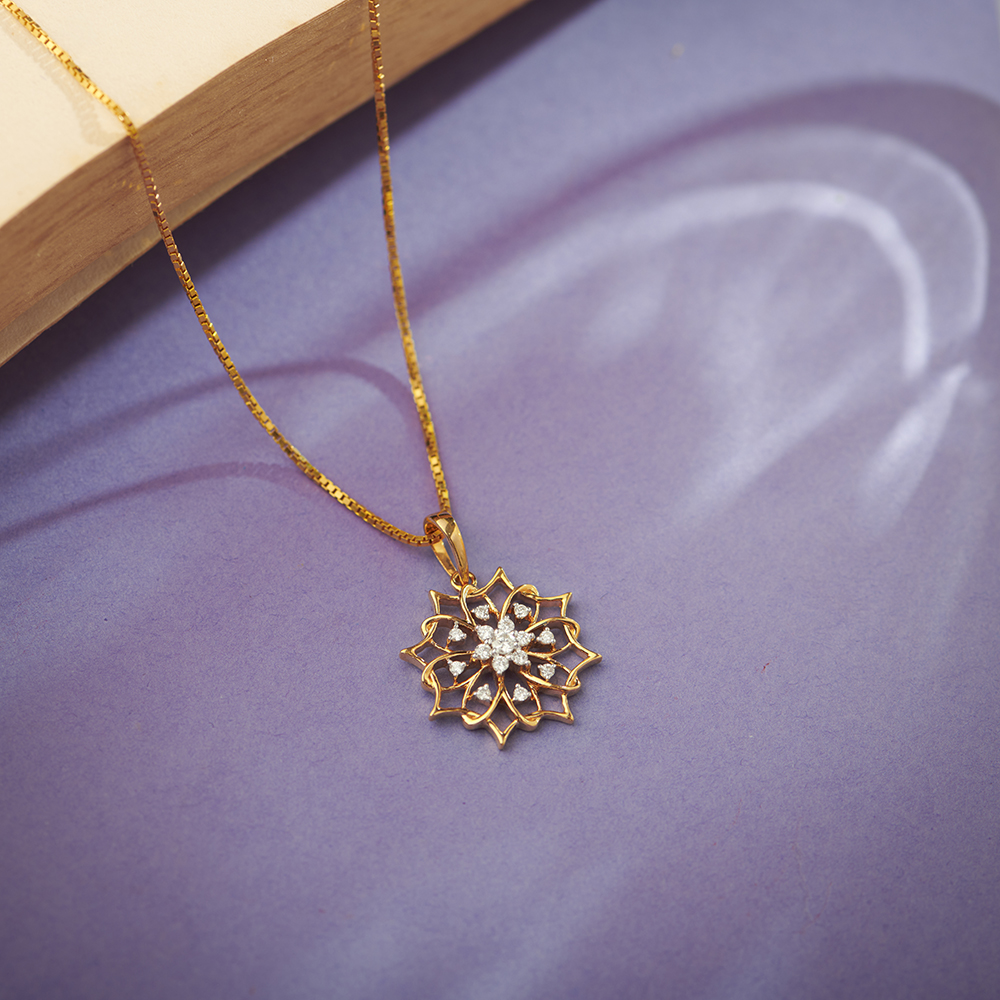 

Entrancing 18 Karat Yellow Gold And Diamond Floral Pendant