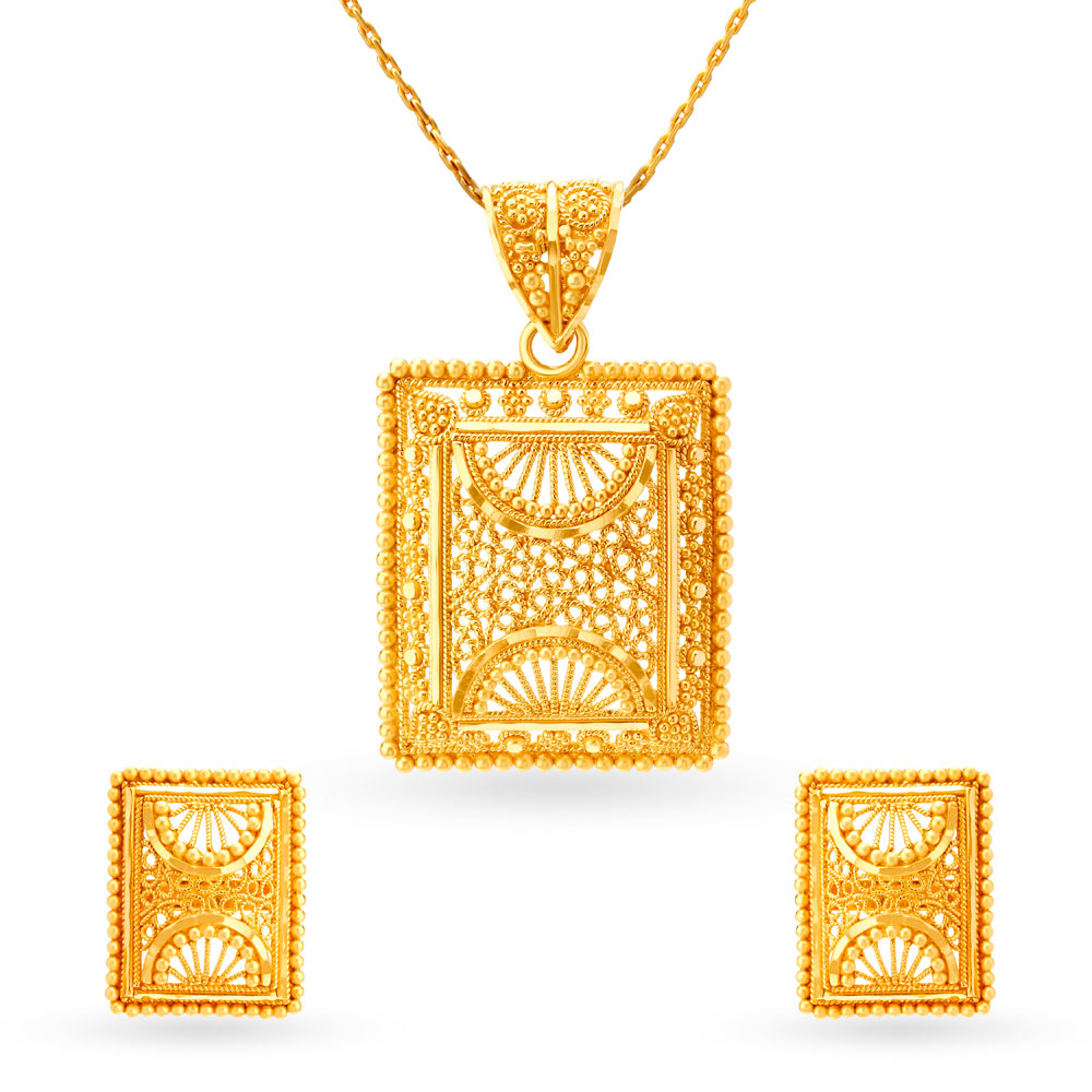 

Elaborate Gold Pendant and Earrings Set