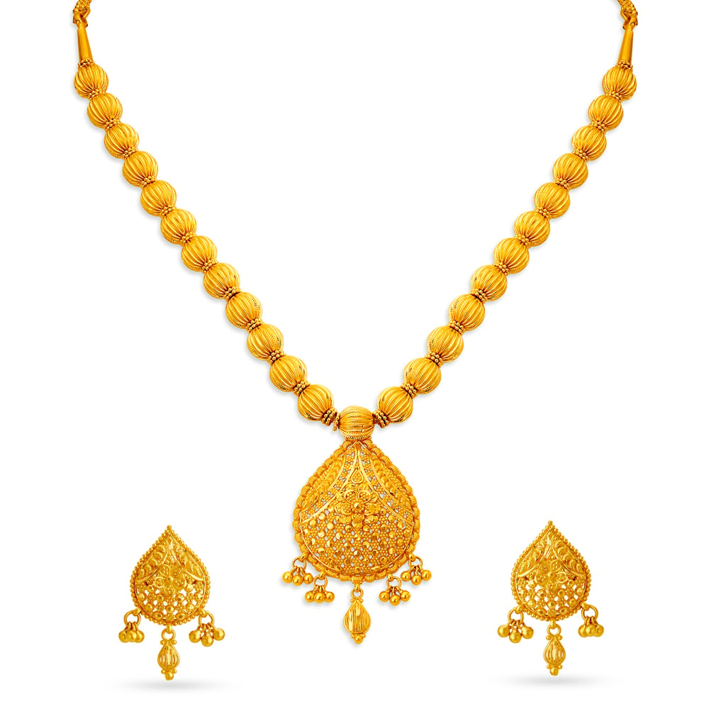 

Stately Gold Nakashi Necklace Set for the Tamil Bride